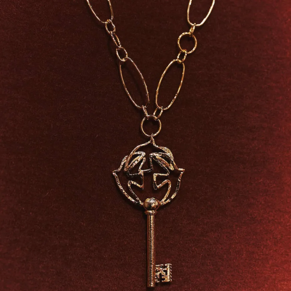 Pendentif doré Clé